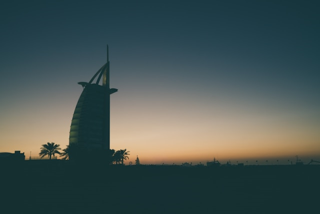 Sunset behind a Dubai landmark